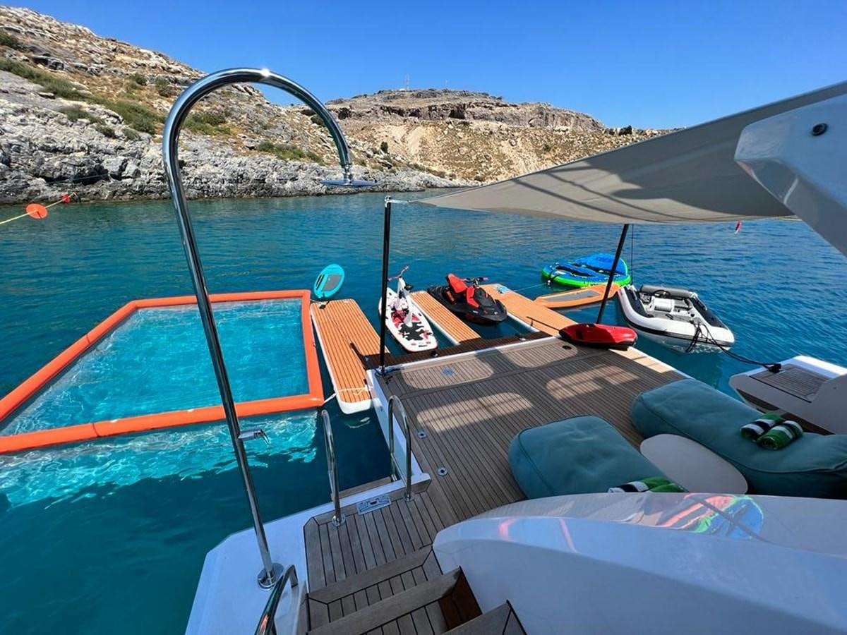 a boat is parked on the water aboard LOVE T Yacht for Sale
