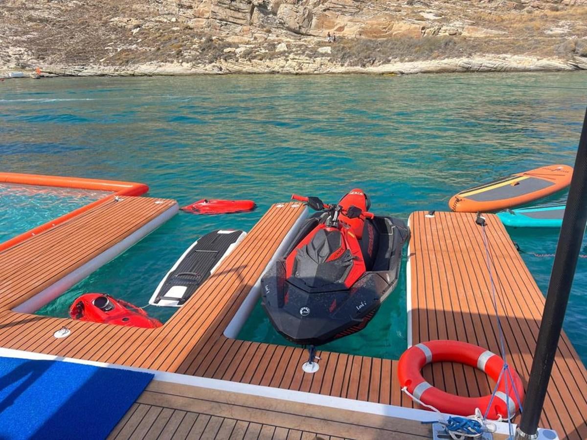 a boat with kayaks on it aboard LOVE T Yacht for Sale