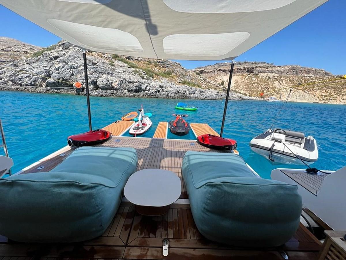 a group of boats sit on a dock aboard LOVE T Yacht for Sale