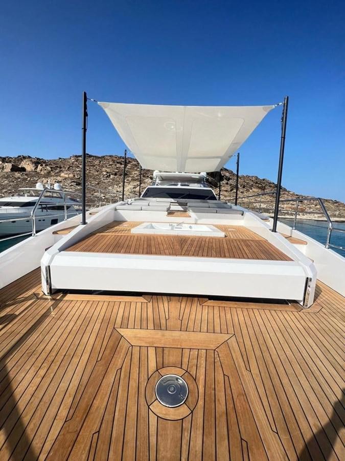 a boat on a deck aboard LOVE T Yacht for Sale