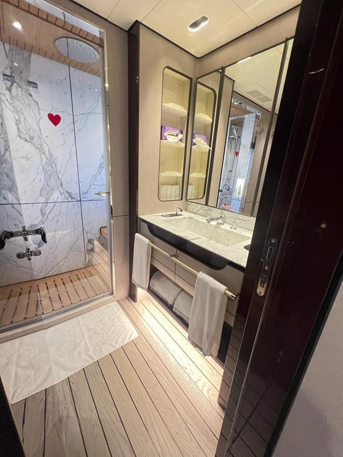 a bathroom with a large shower aboard LOVE T Yacht for Sale