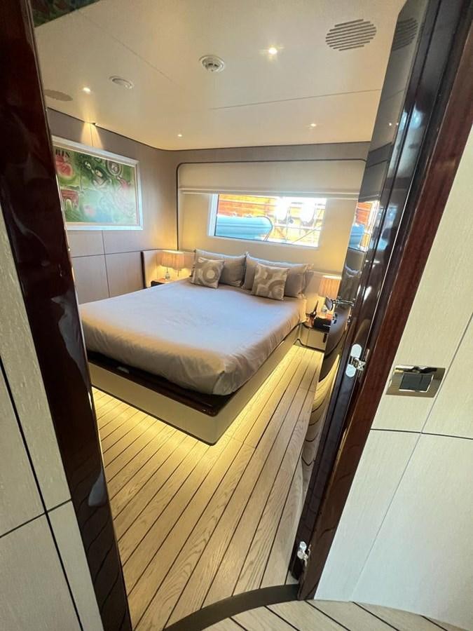 a bed in a room aboard LOVE T Yacht for Sale
