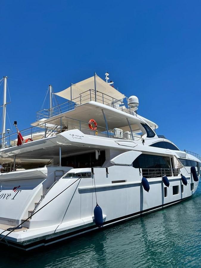 a boat docked at a pier aboard LOVE T Yacht for Sale