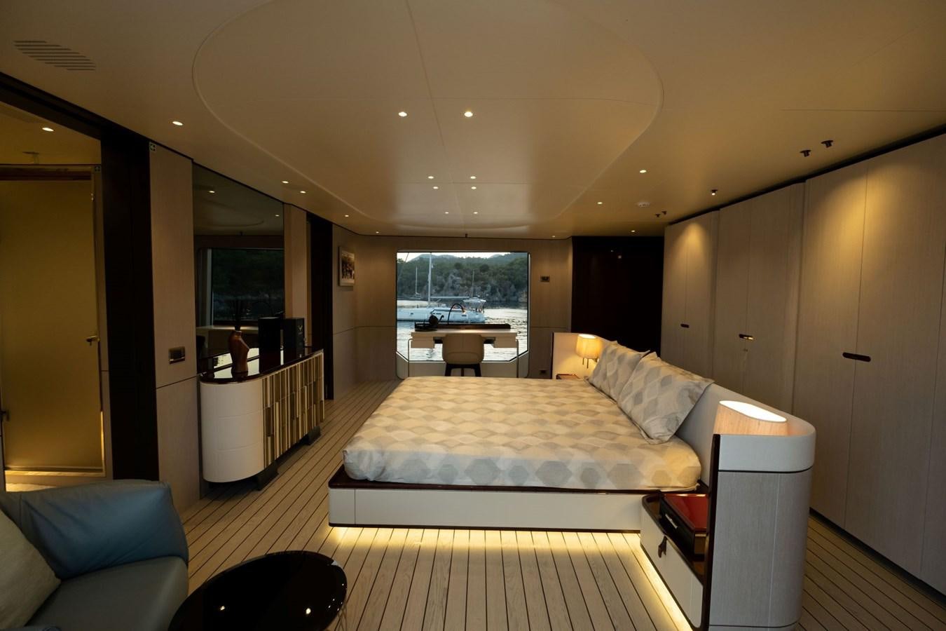 a large bedroom with a large bed aboard LOVE T Yacht for Sale