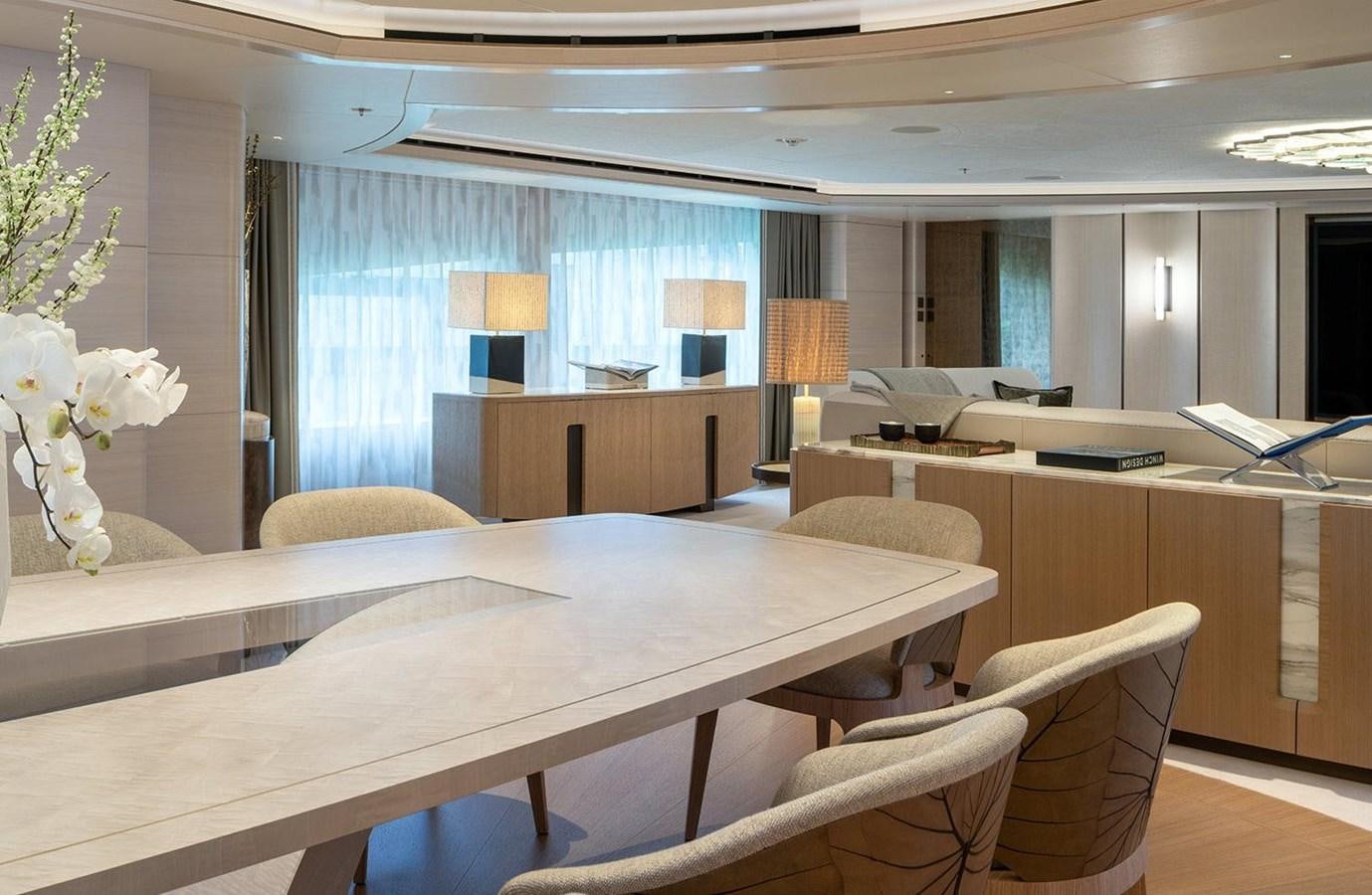 a room with a table chairs and a window aboard SPARTA Yacht for Sale