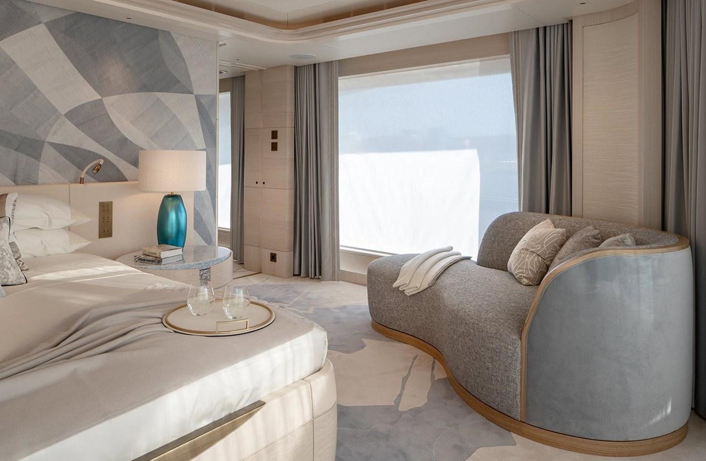 a room with a bed and a chair aboard SPARTA Yacht for Sale