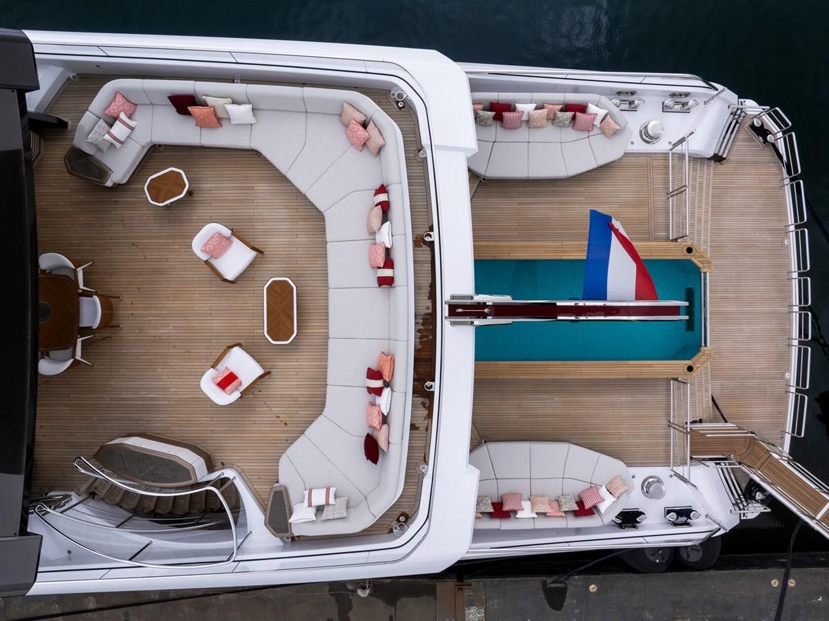 a white boat with red and blue sails aboard SPARTA Yacht for Sale