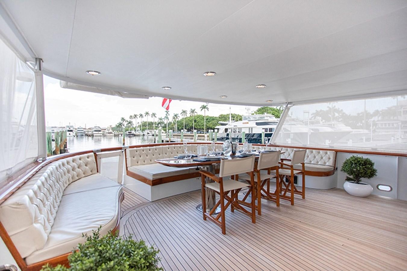 a room with a table and chairs aboard SOVEREIGN Yacht for Sale