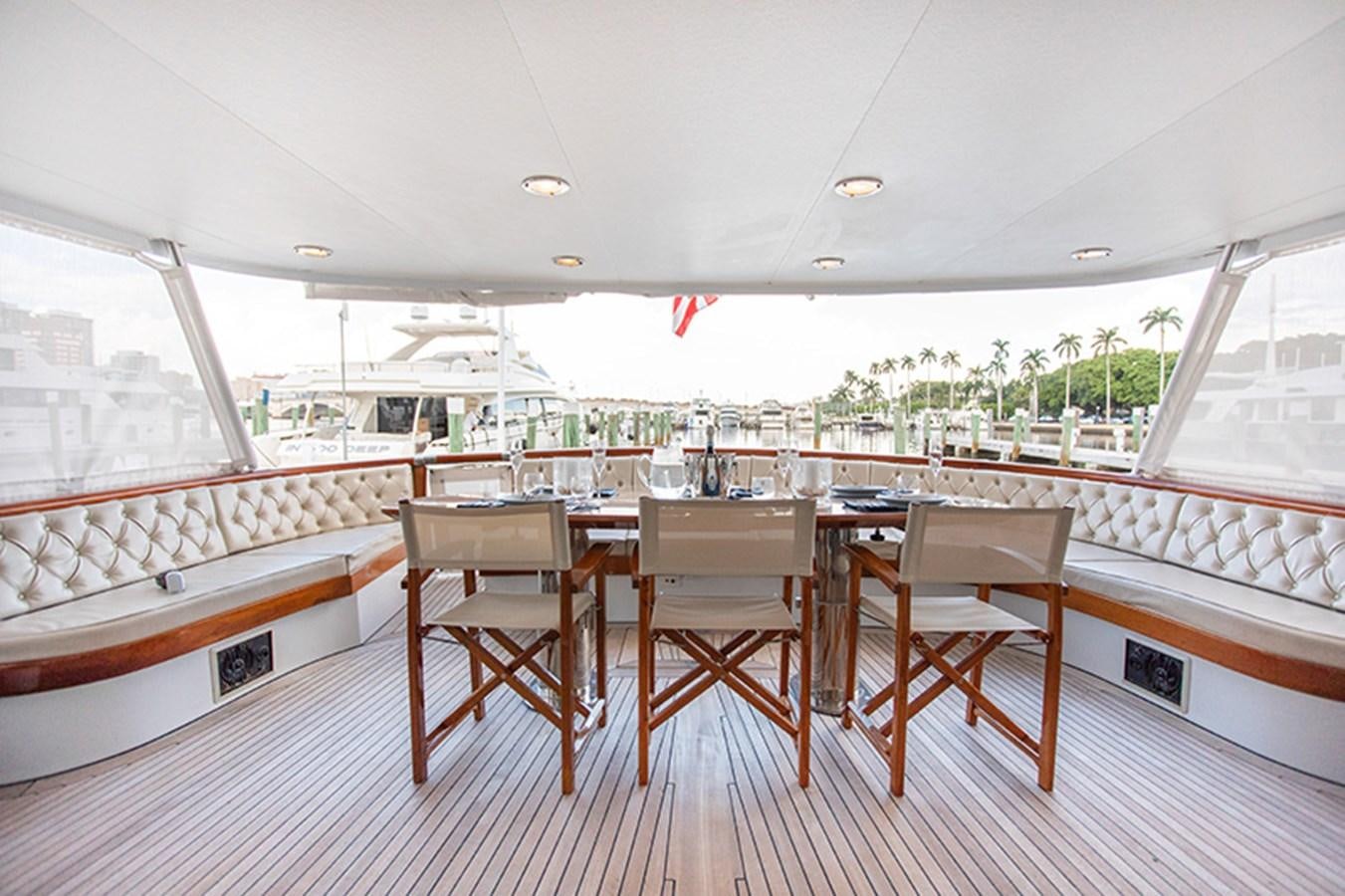 a room with a table and chairs aboard SOVEREIGN Yacht for Sale
