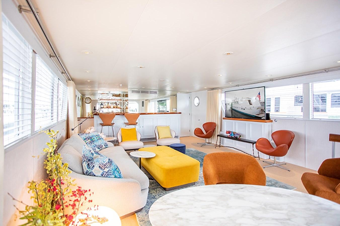 a living room with a large window aboard SOVEREIGN Yacht for Sale