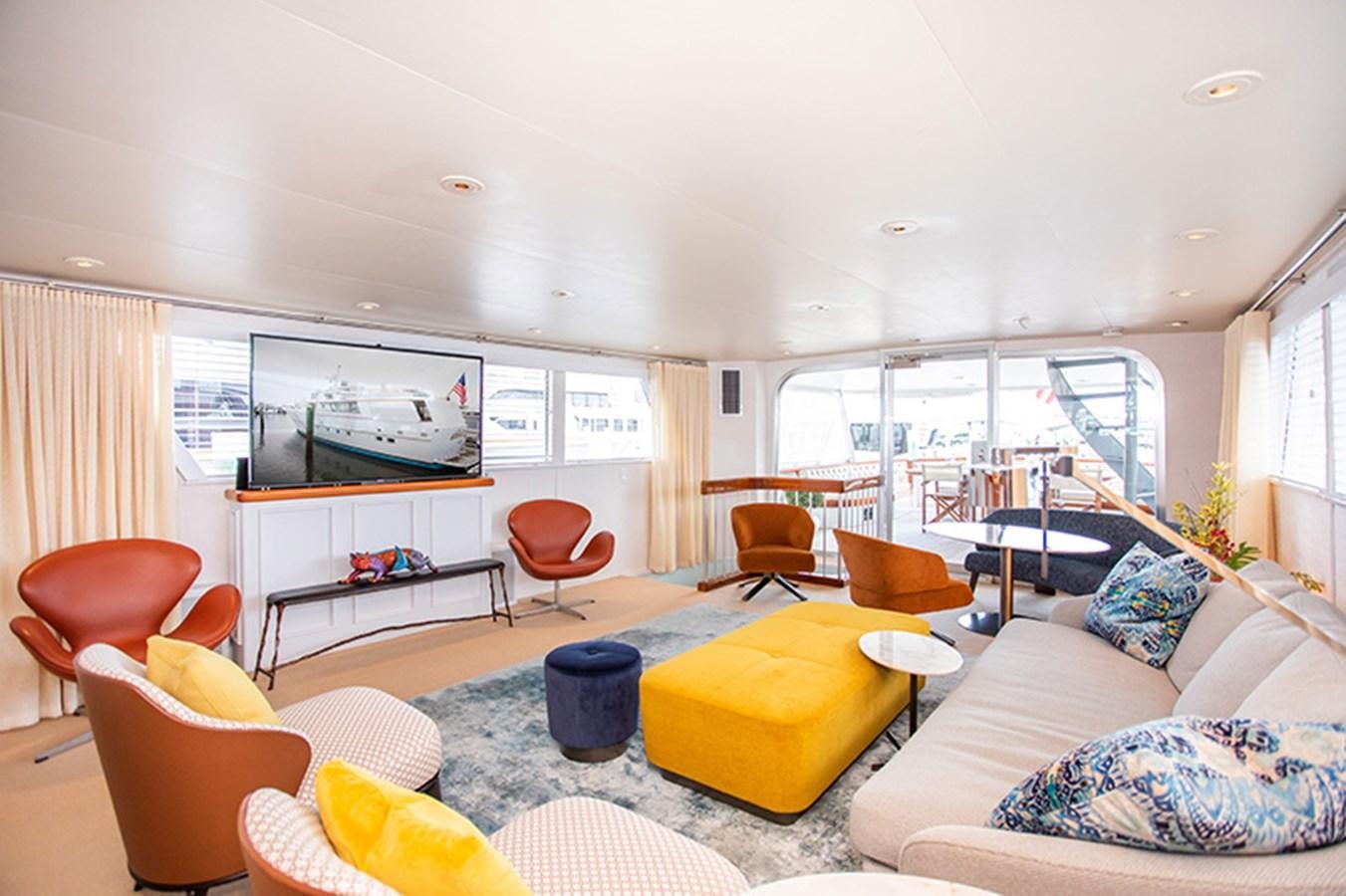 a living room with a large window aboard SOVEREIGN Yacht for Sale