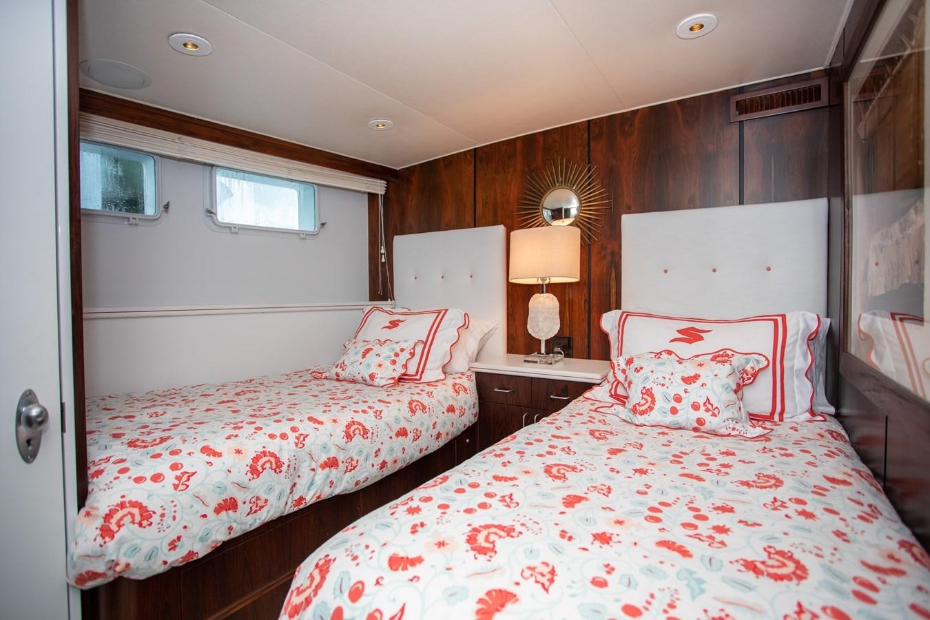 a couple of beds in a hotel room aboard SOVEREIGN Yacht for Sale