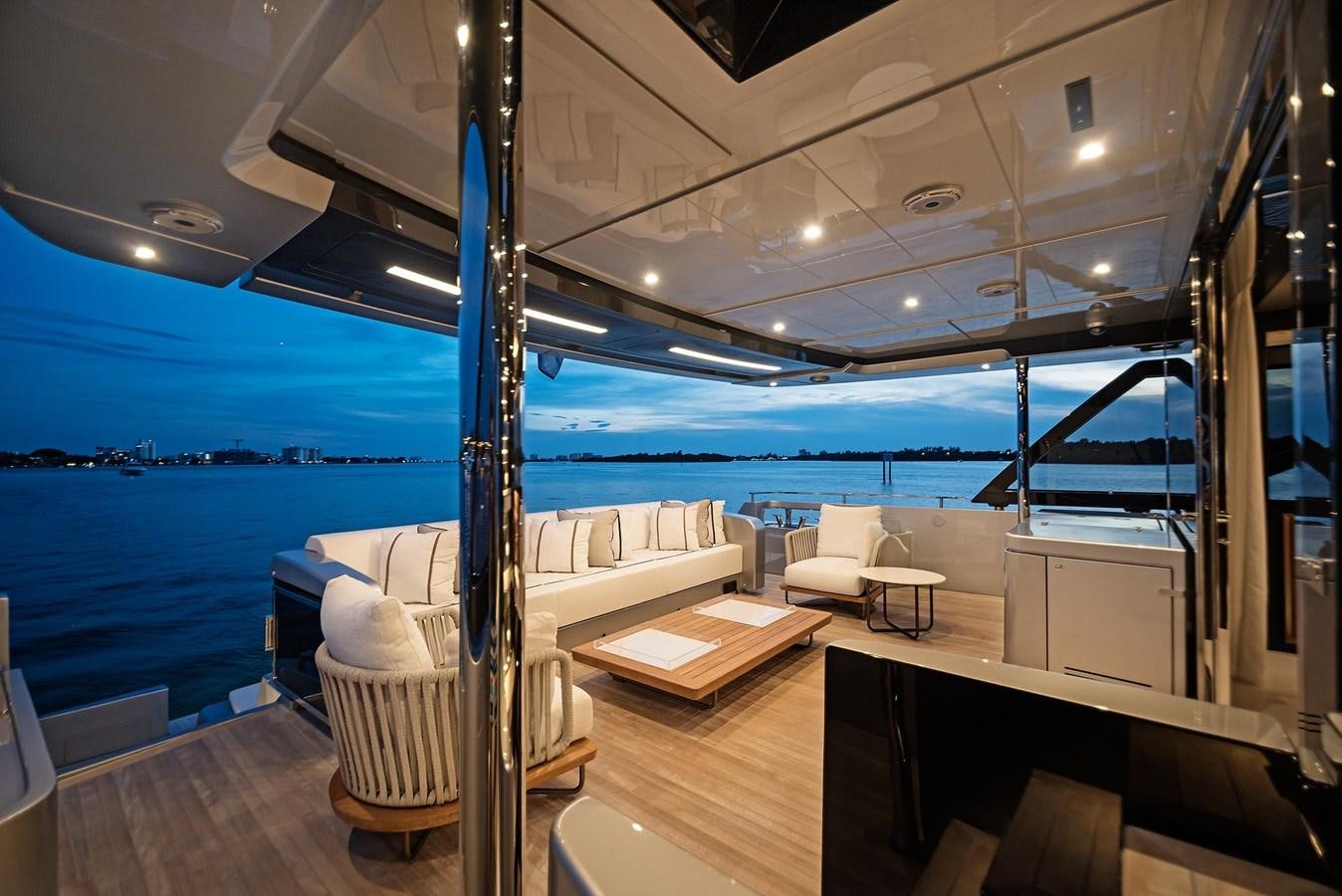 a room with a bed and a large body of water aboard ALLEGRA  @ AVENTURA Yacht for Sale