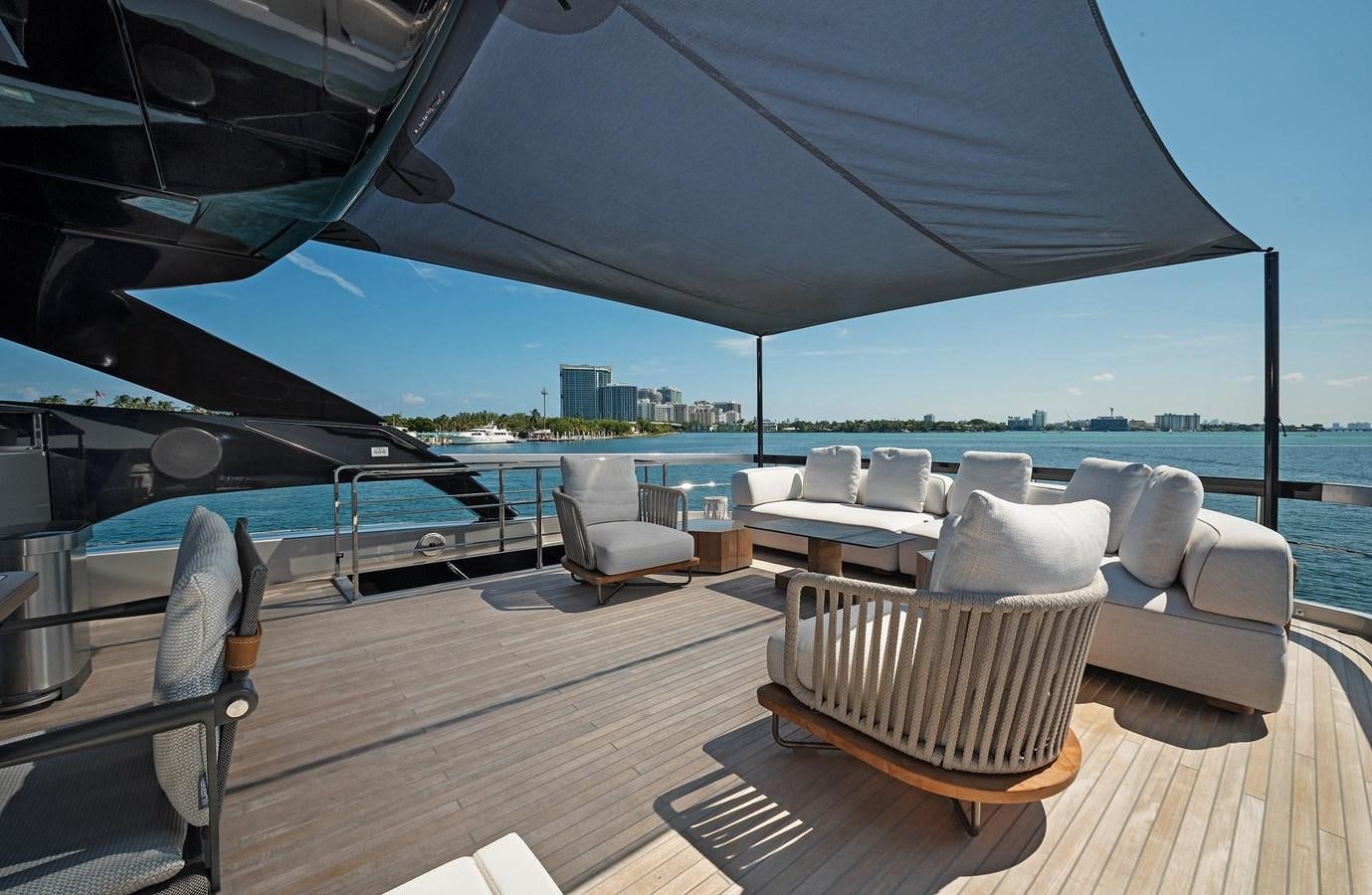 a deck with a view of the water and a city aboard ALLEGRA  @ AVENTURA Yacht for Sale