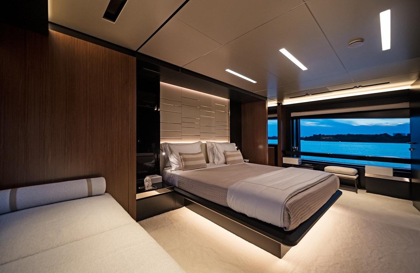 a room with a bed and a tv aboard ALLEGRA  @ AVENTURA Yacht for Sale