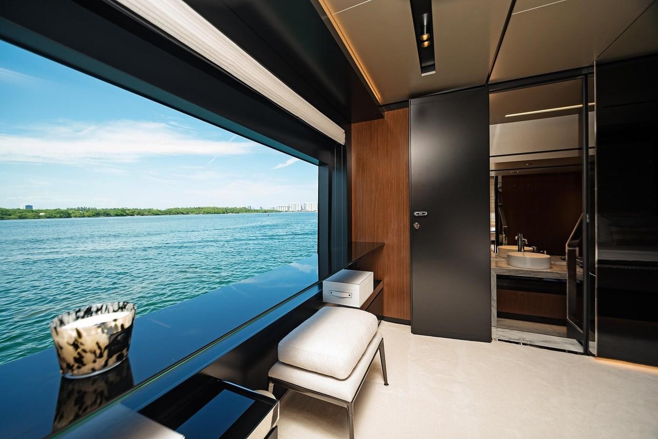 a room with a large window and a view of the water aboard ALLEGRA  @ AVENTURA Yacht for Sale