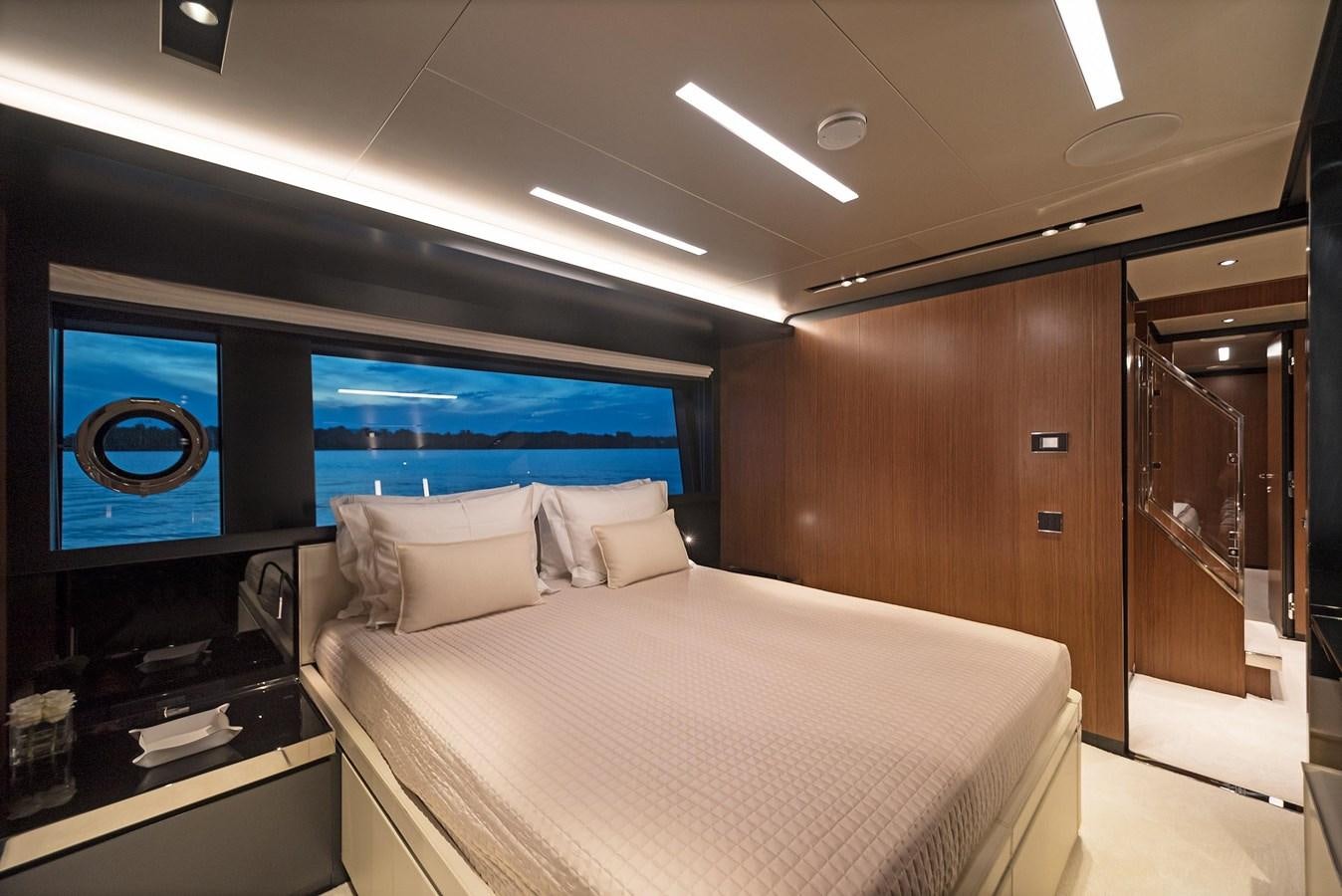 a bed in a room aboard ALLEGRA  @ AVENTURA Yacht for Sale