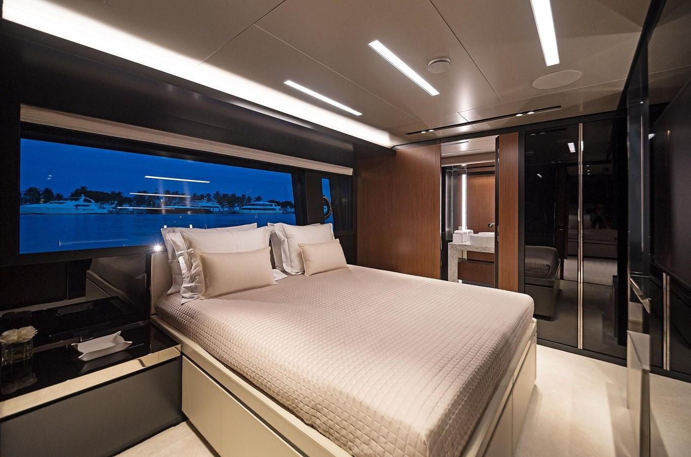 a room with a bed and a tv aboard ALLEGRA  @ AVENTURA Yacht for Sale