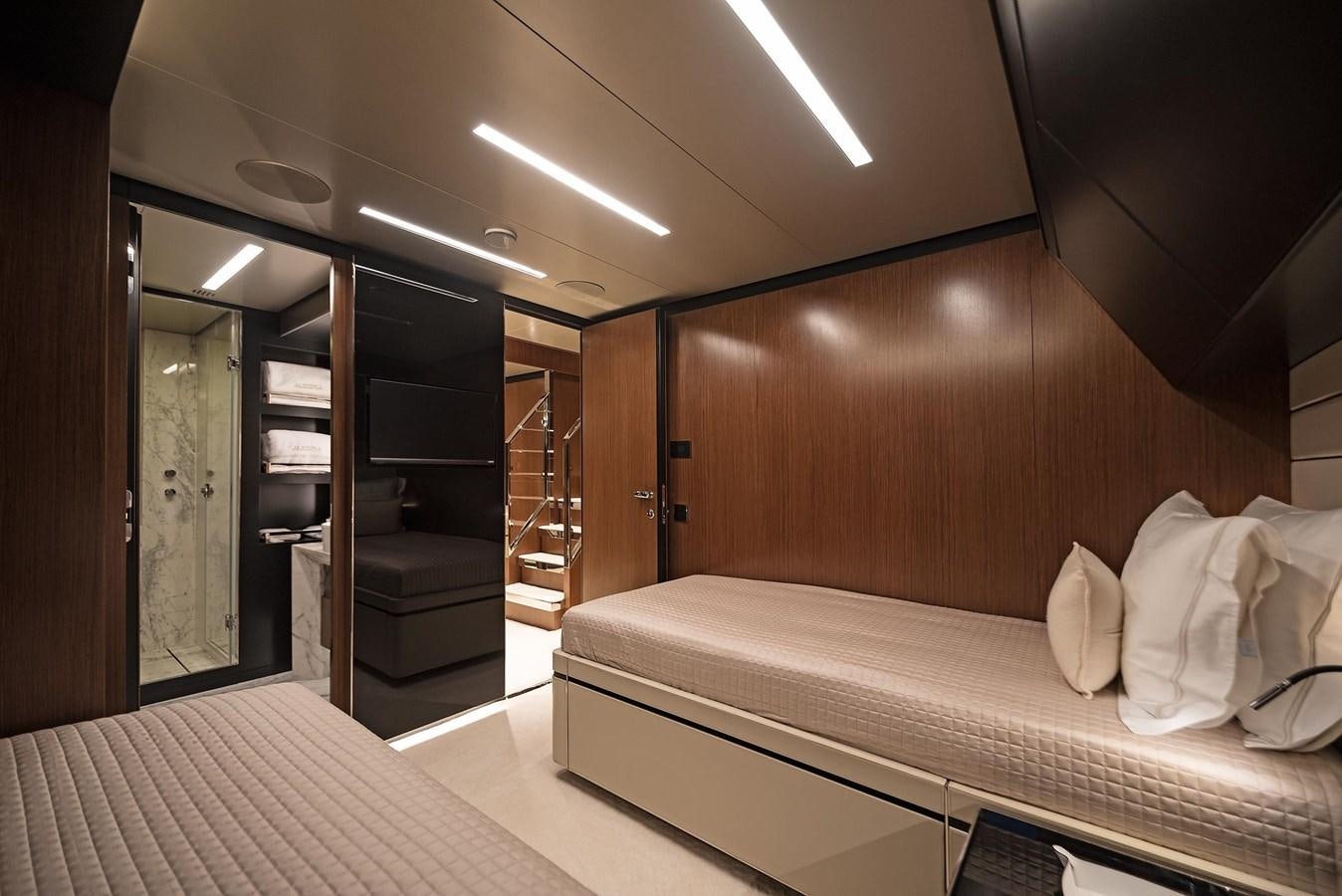a room with a bed and a mirror aboard ALLEGRA  @ AVENTURA Yacht for Sale