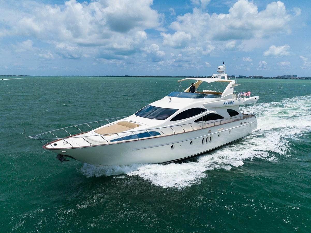 a white yacht on the water aboard 80 CARAT Yacht for Sale