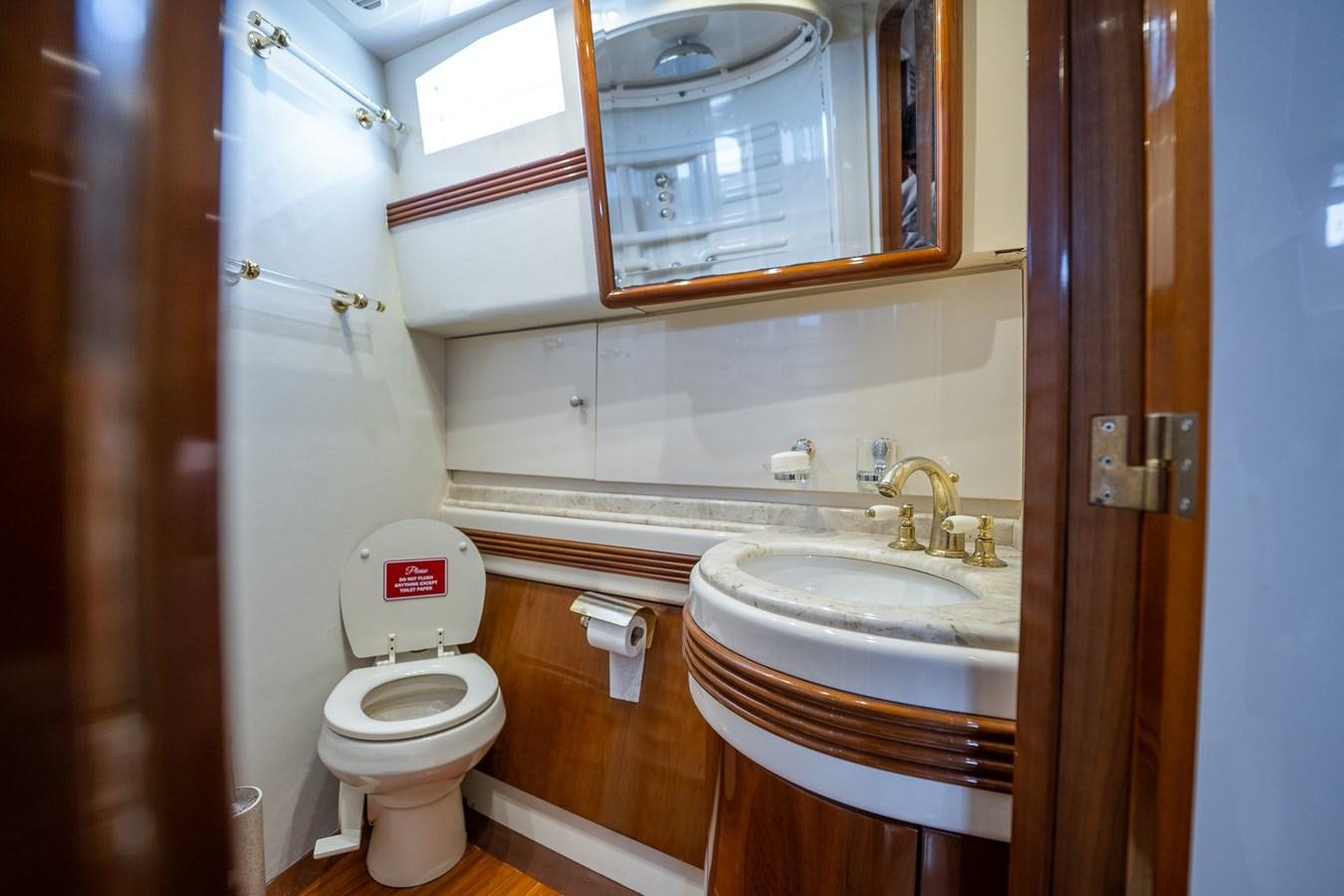 a bathroom with a toilet and sink aboard 80 CARAT Yacht for Sale