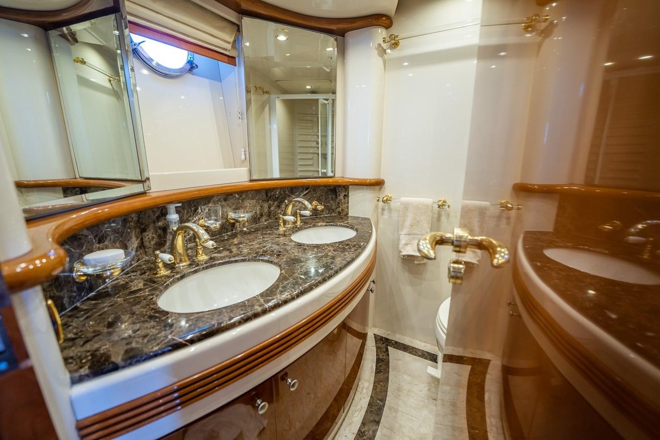 a bathroom with a sink and bathtub aboard 80 CARAT Yacht for Sale