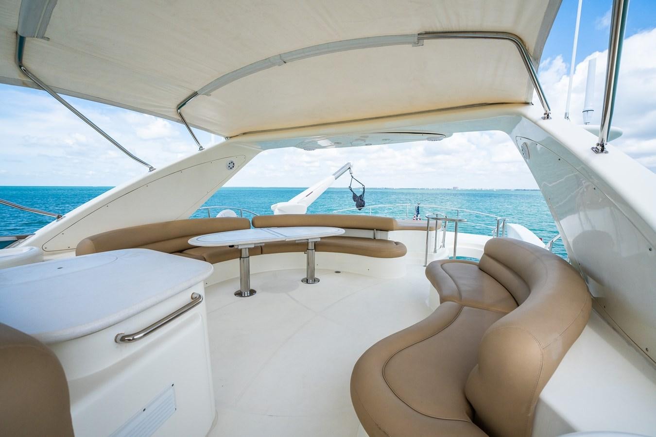 a person sitting on a boat aboard 80 CARAT Yacht for Sale