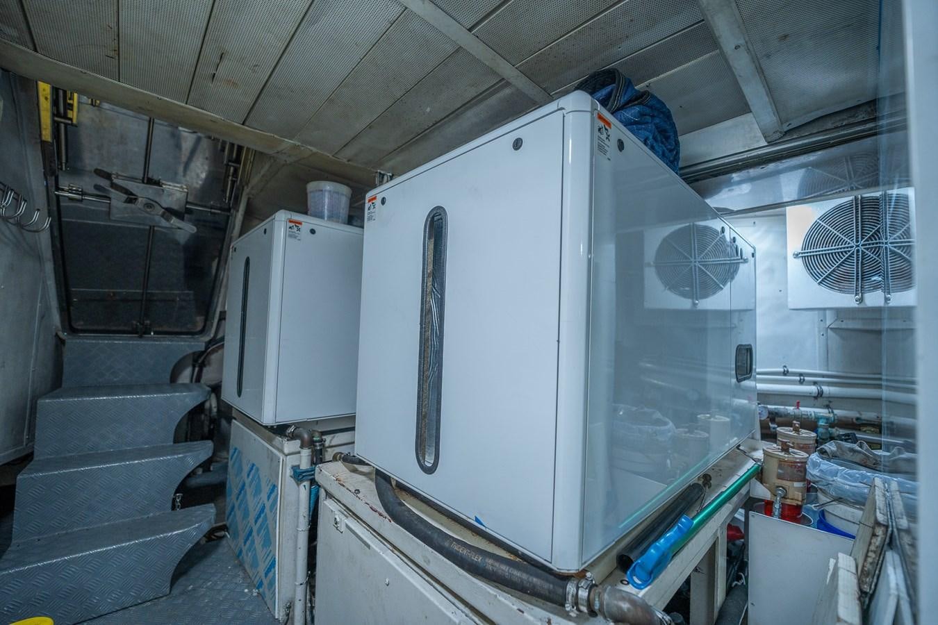 a large white machine in a room aboard 80 CARAT Yacht for Sale