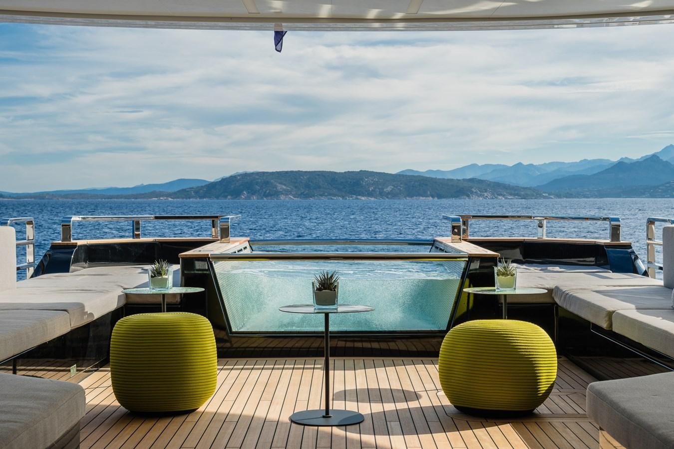 a balcony overlooking a body of water aboard UV II Yacht for Sale