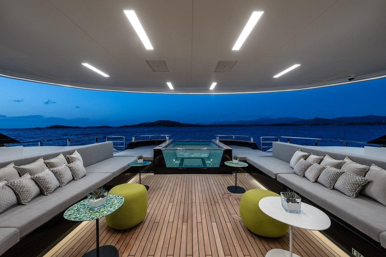 a living room with a couch and a table aboard UV II Yacht for Sale