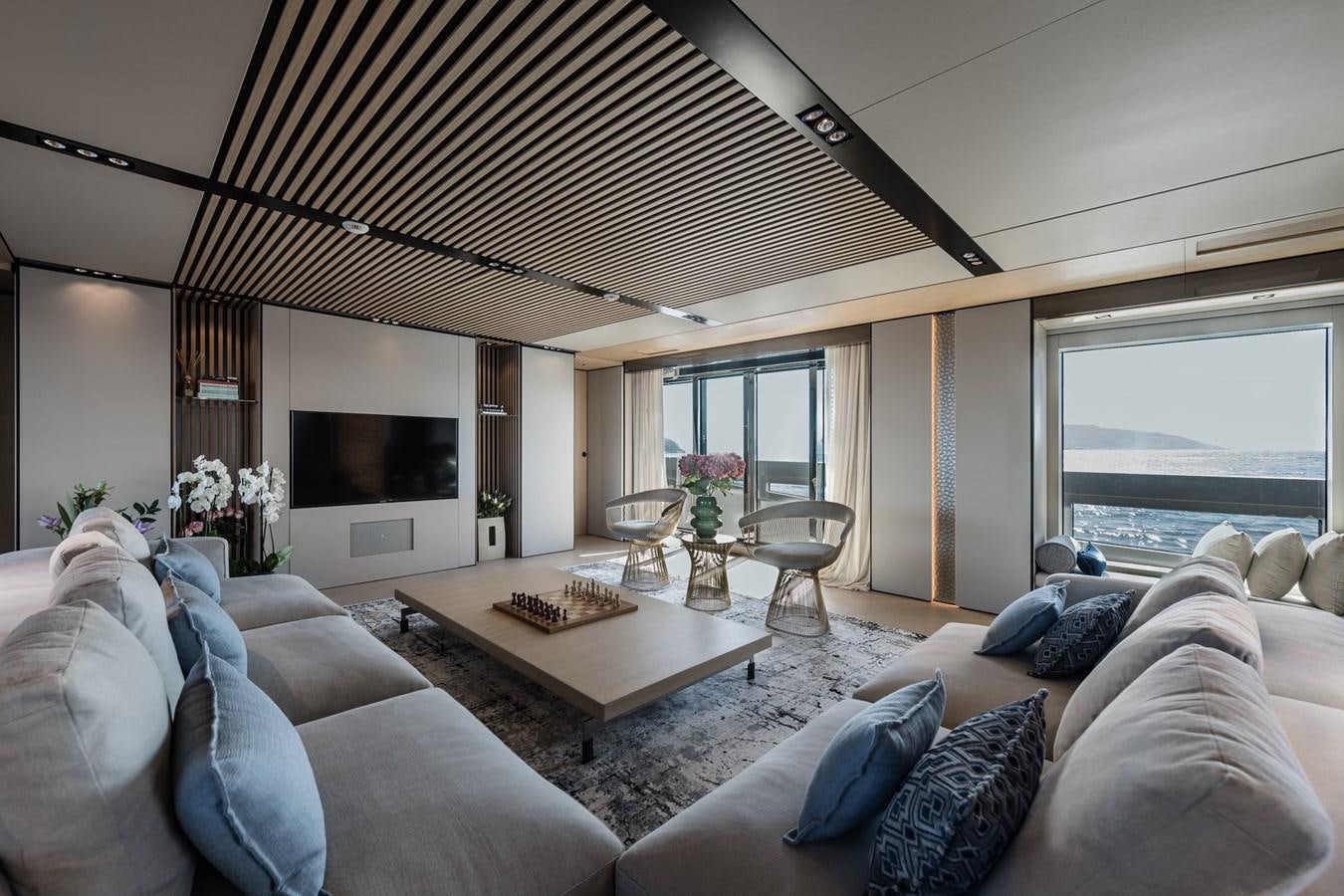 a living room with a large ceiling aboard UV II Yacht for Sale