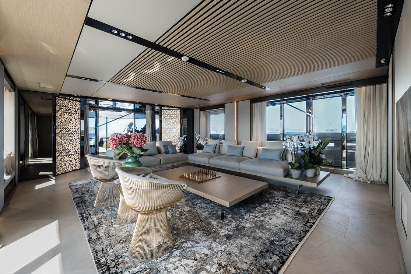 a living room with a large open window aboard UV II Yacht for Sale