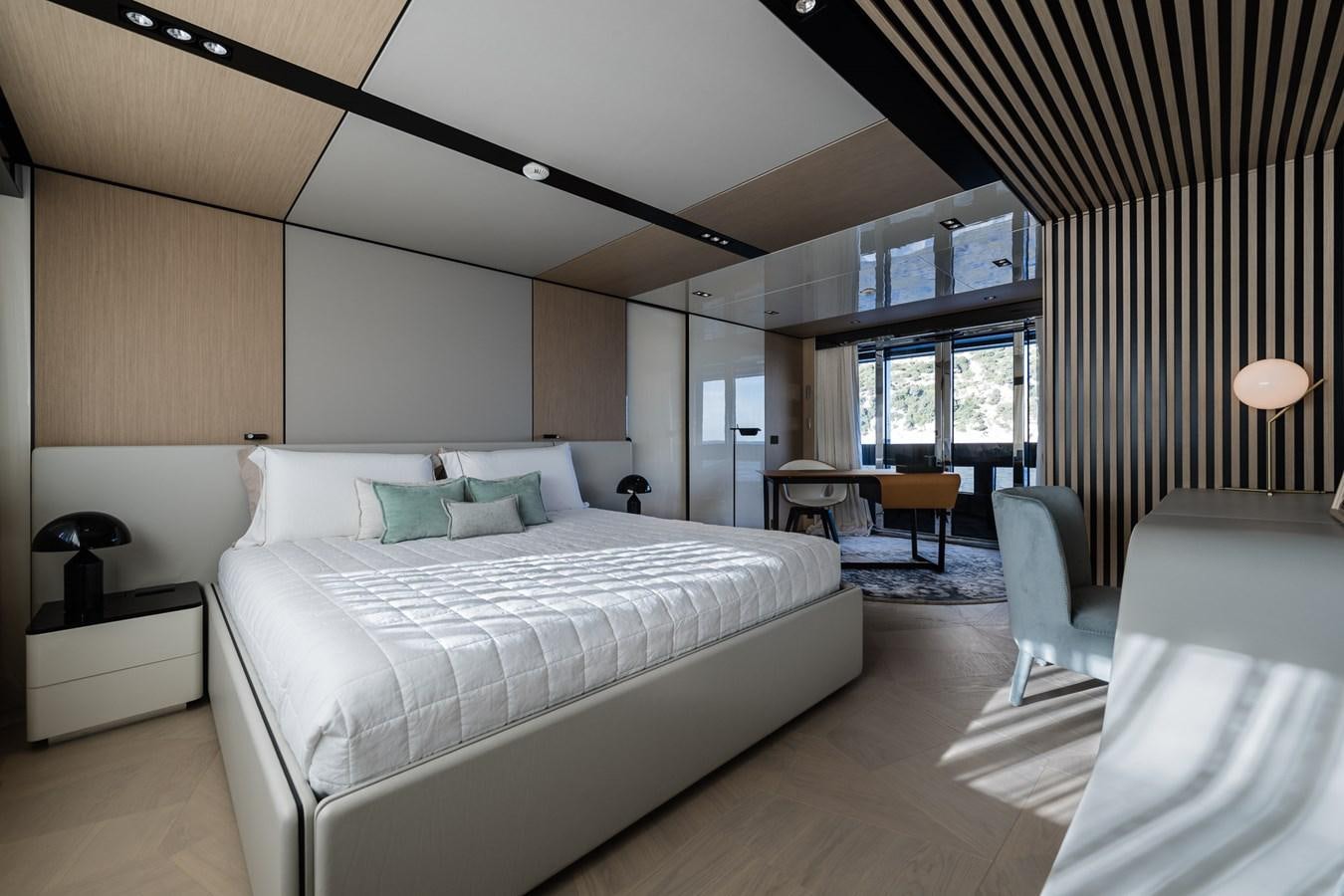 a large bedroom with a large bed aboard UV II Yacht for Sale