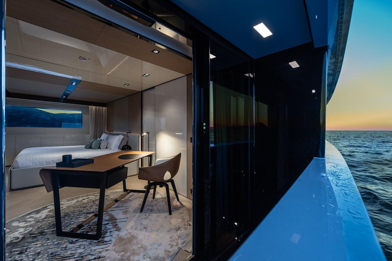 a room with a table and chairs aboard UV II Yacht for Sale
