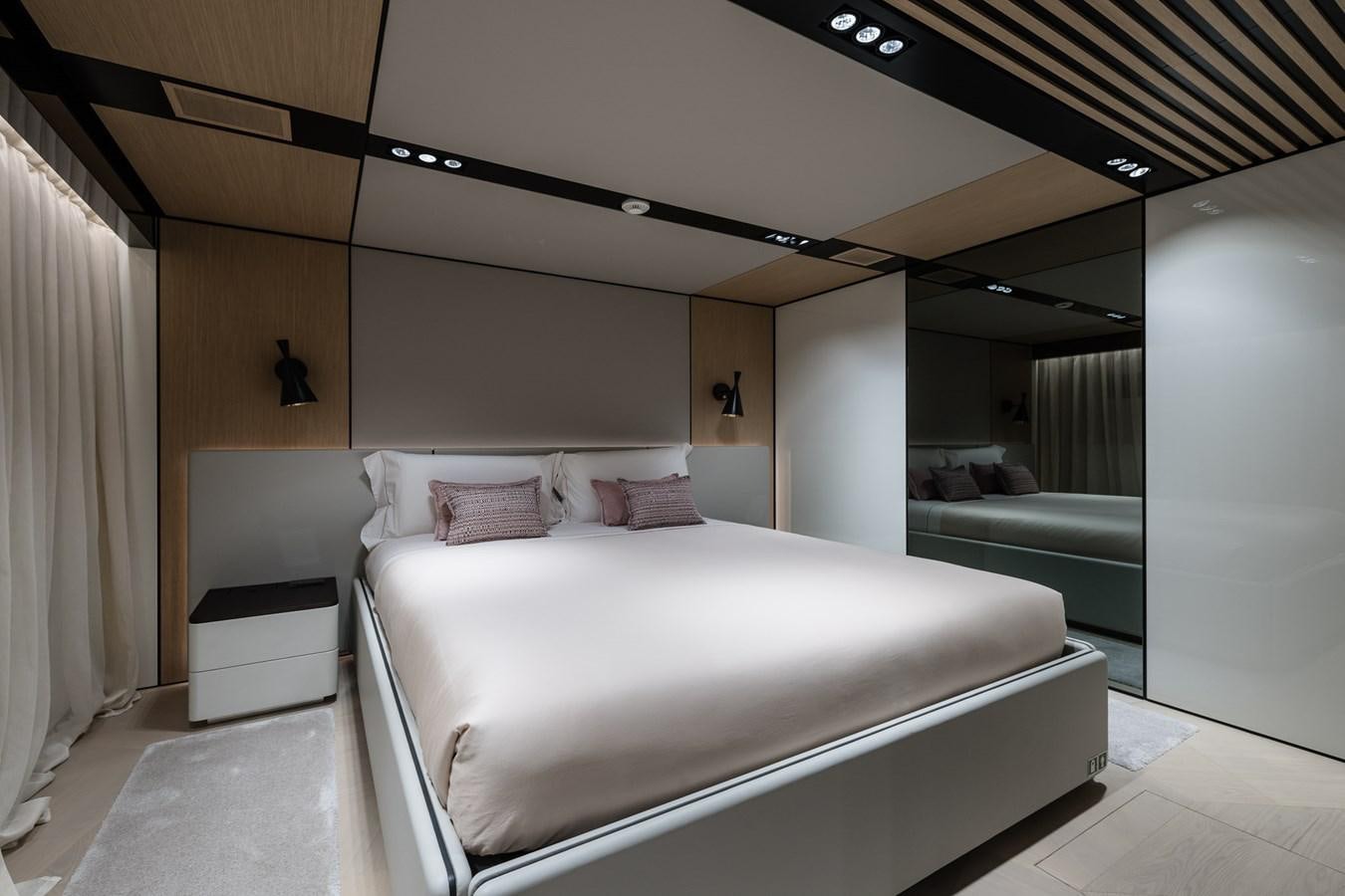 a bed in a room aboard UV II Yacht for Sale