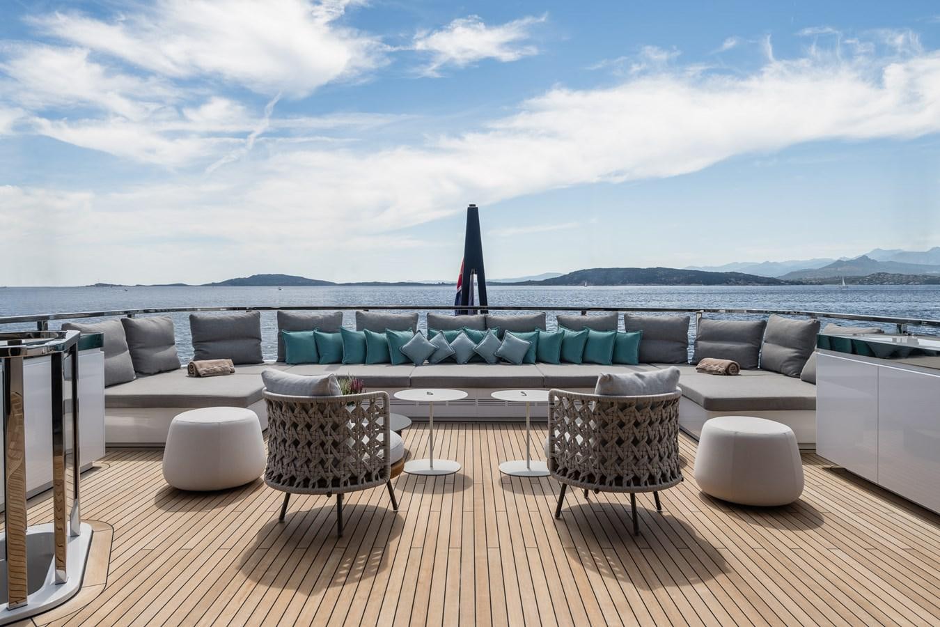 a living room with a large sofa aboard UV II Yacht for Sale