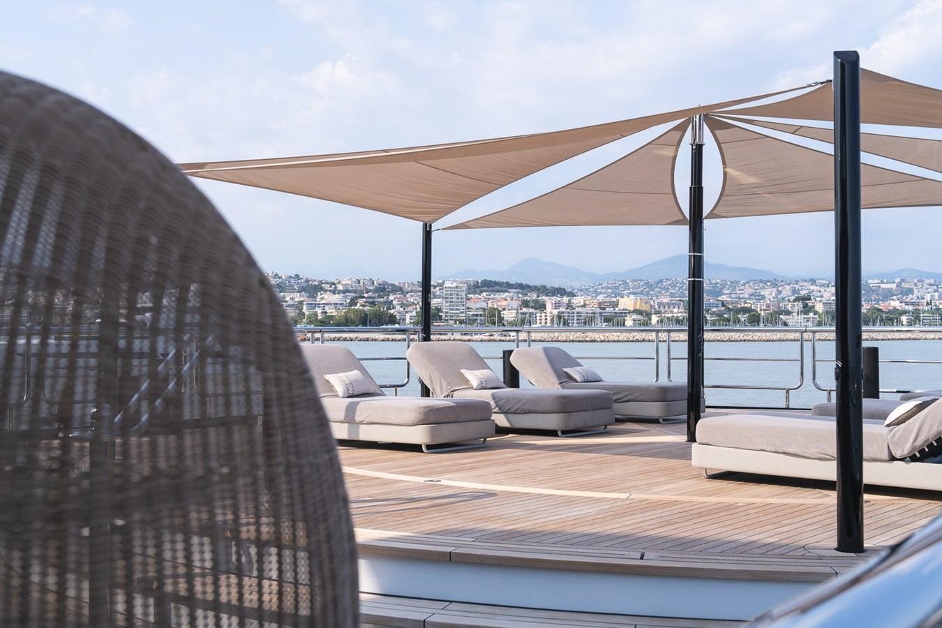 a room with a view of a city and a large body of water aboard WHISPER Yacht for Sale