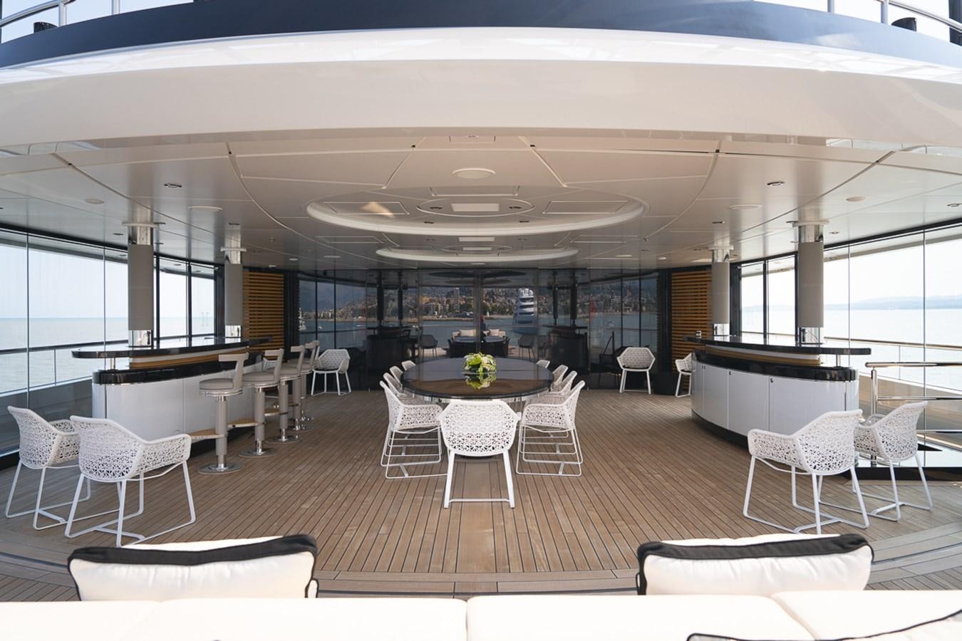 a large modern room with a large table and chairs aboard WHISPER Yacht for Sale