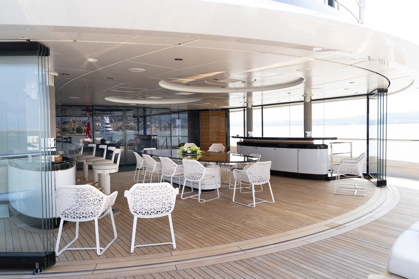 a room with a table chairs and a large window aboard WHISPER Yacht for Sale