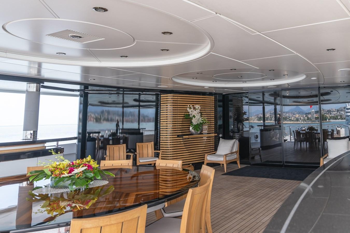 a large room with tables and chairs aboard WHISPER Yacht for Sale