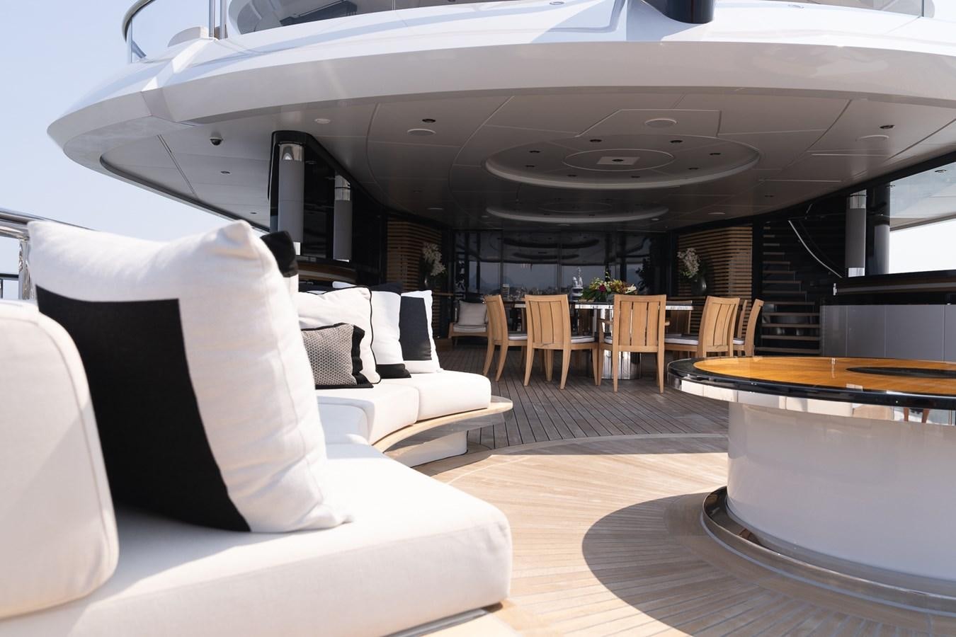 a room with a couch and a table and chairs aboard WHISPER Yacht for Sale