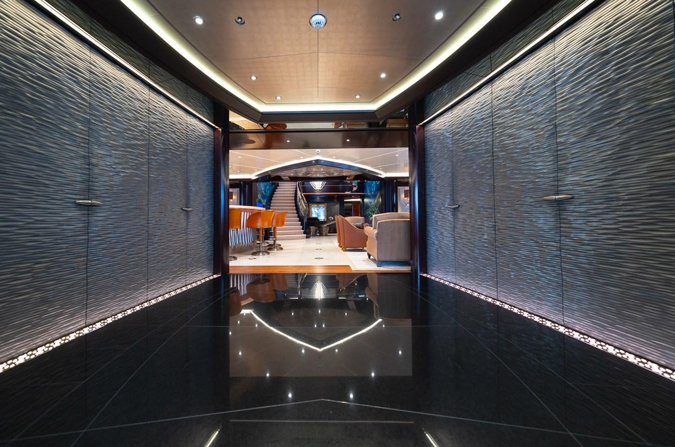 a large kitchen with black cabinets aboard WHISPER Yacht for Sale