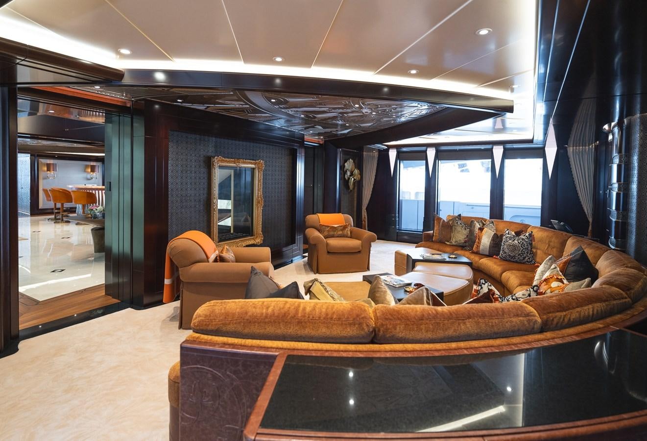 a living room with leather couches aboard WHISPER Yacht for Sale