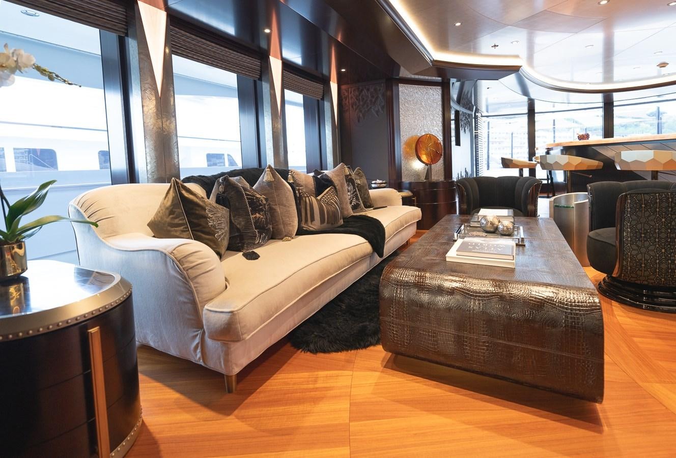 a living room with a couch and a table aboard WHISPER Yacht for Sale