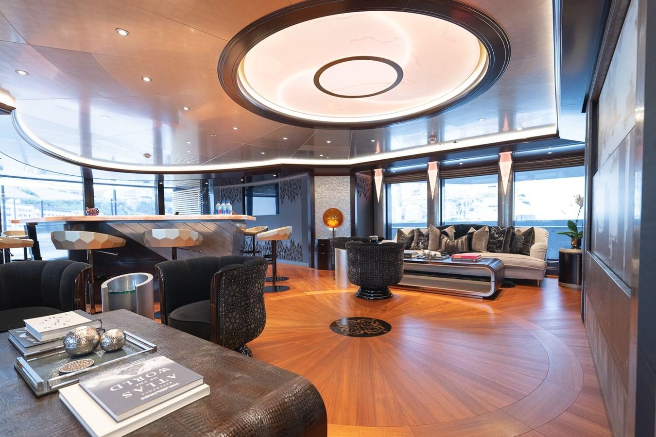 a room with a table chairs and a large window aboard WHISPER Yacht for Sale