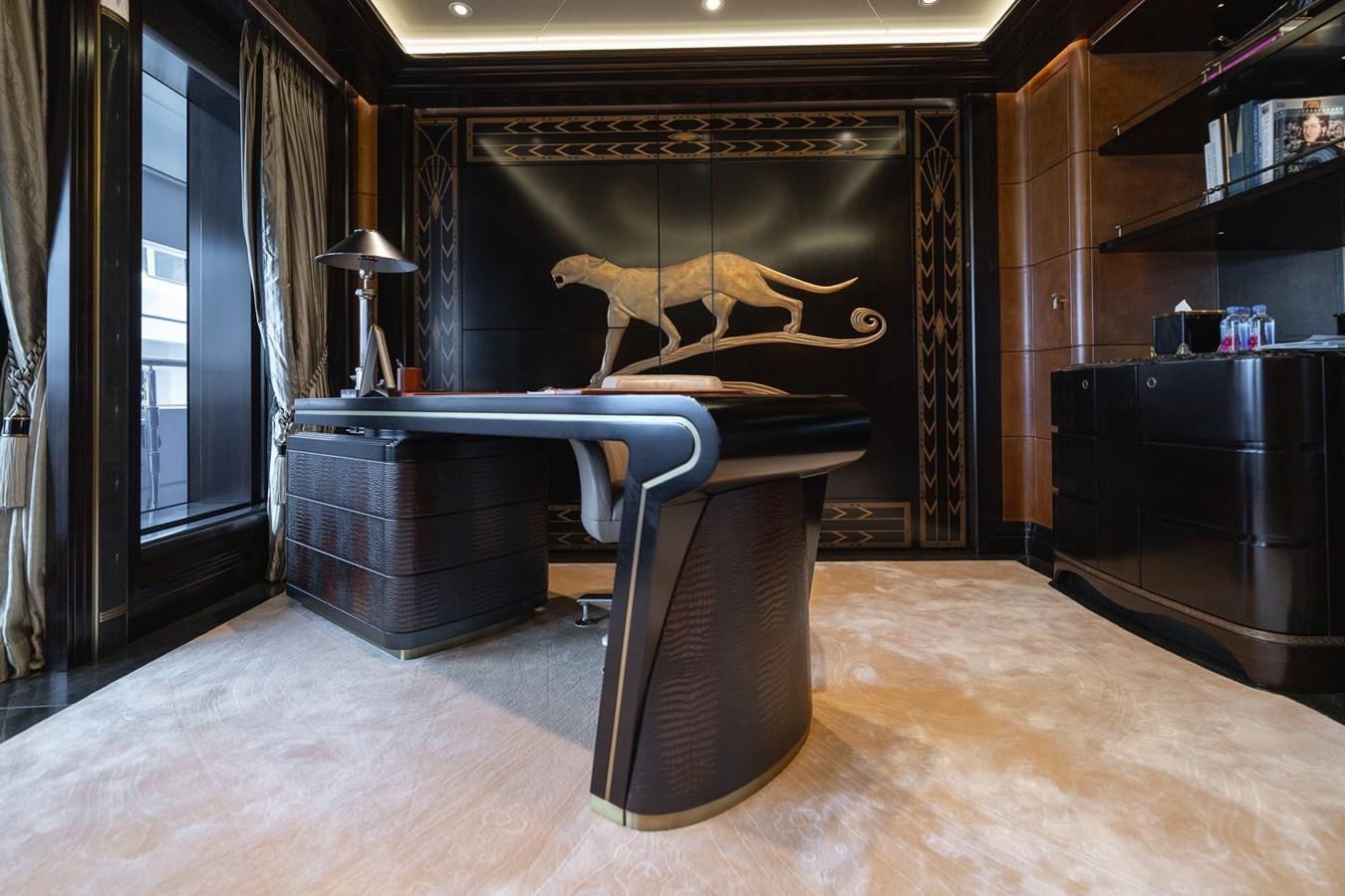 a large black and gold piano aboard WHISPER Yacht for Sale