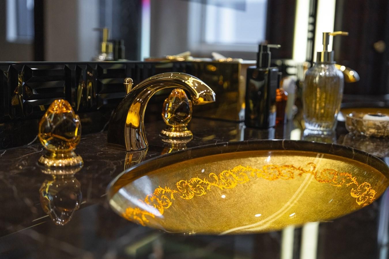 a golden trophy on a table aboard WHISPER Yacht for Sale