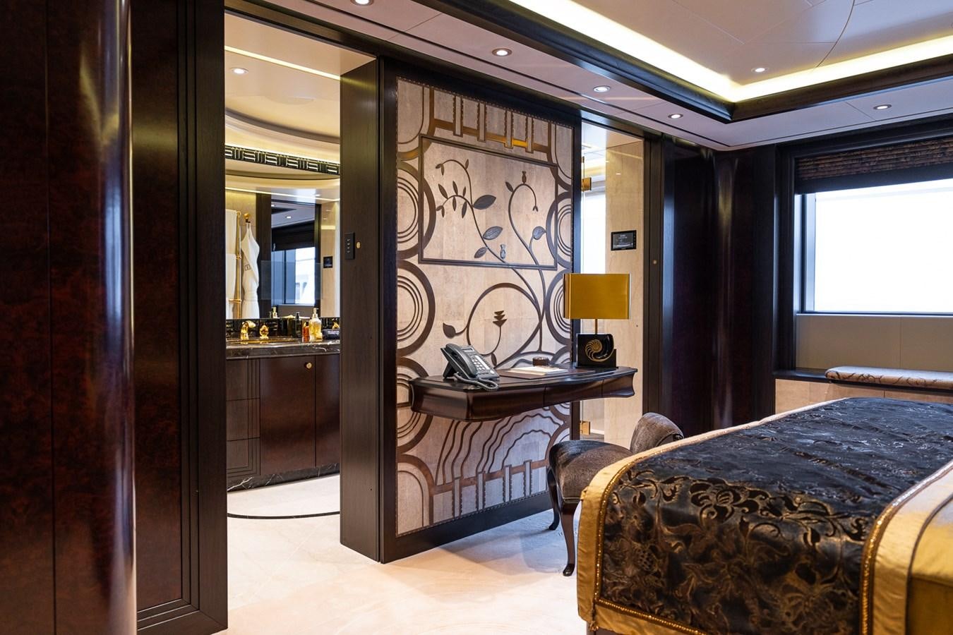 a room with a bed and a desk aboard WHISPER Yacht for Sale