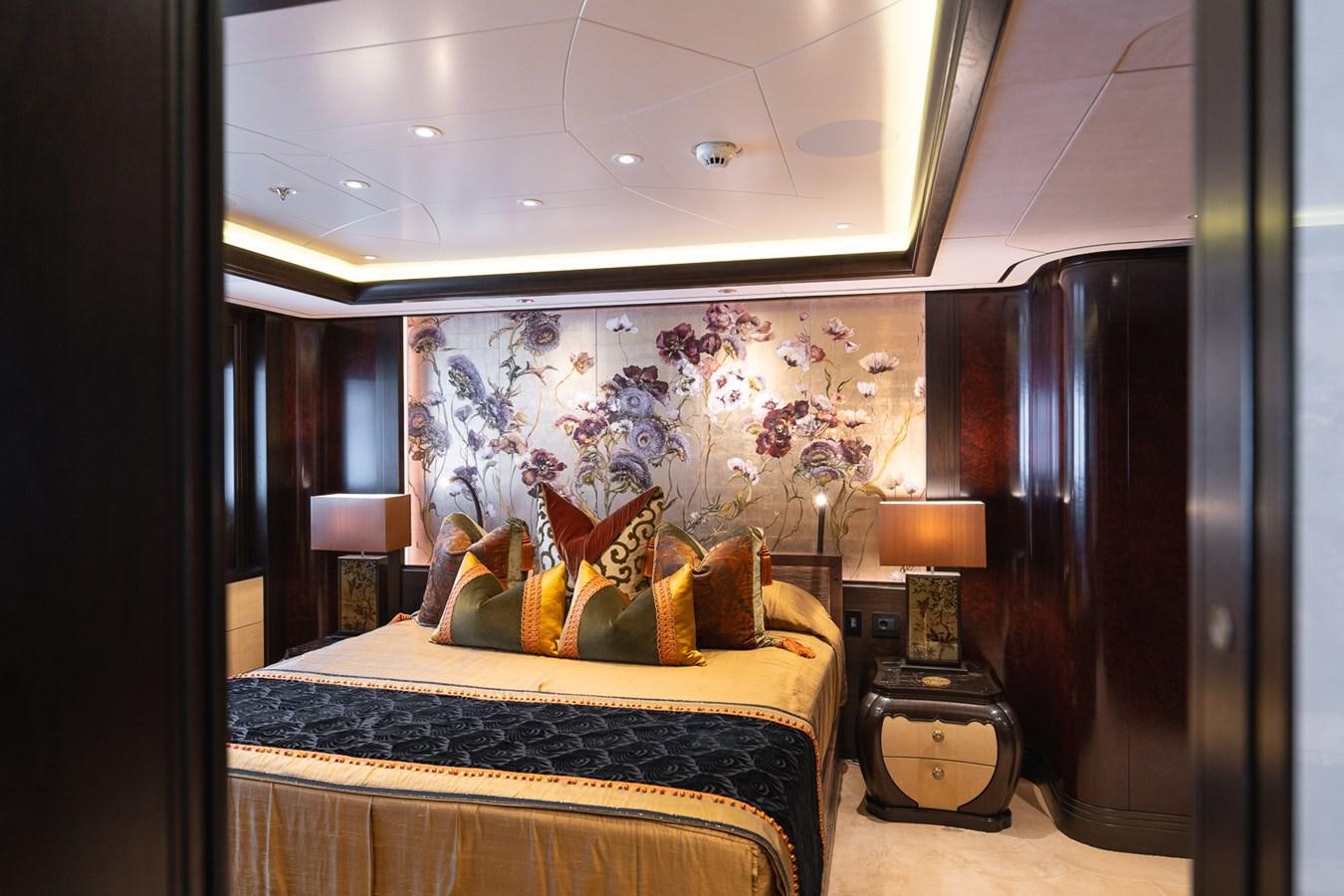 a bedroom with a painting on the wall aboard WHISPER Yacht for Sale
