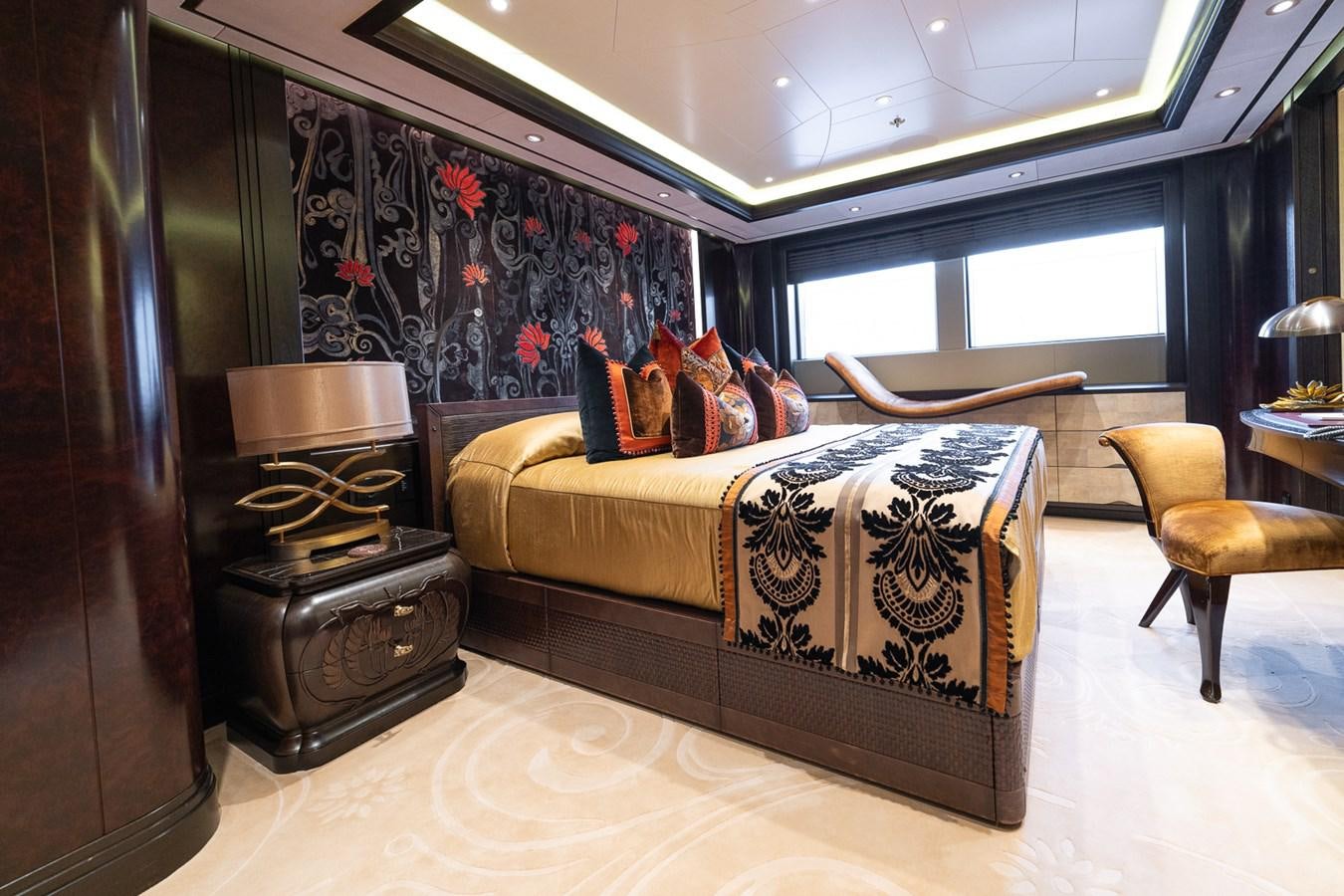 a bedroom with a bed and a desk aboard WHISPER Yacht for Sale